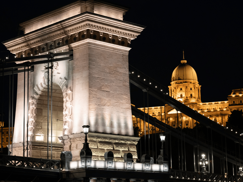Budapest: BBQ Dinner Cruise w/ Live Music & Unlimited Drinks - Parliament, Liberty Bridge, and Budapest after sunset