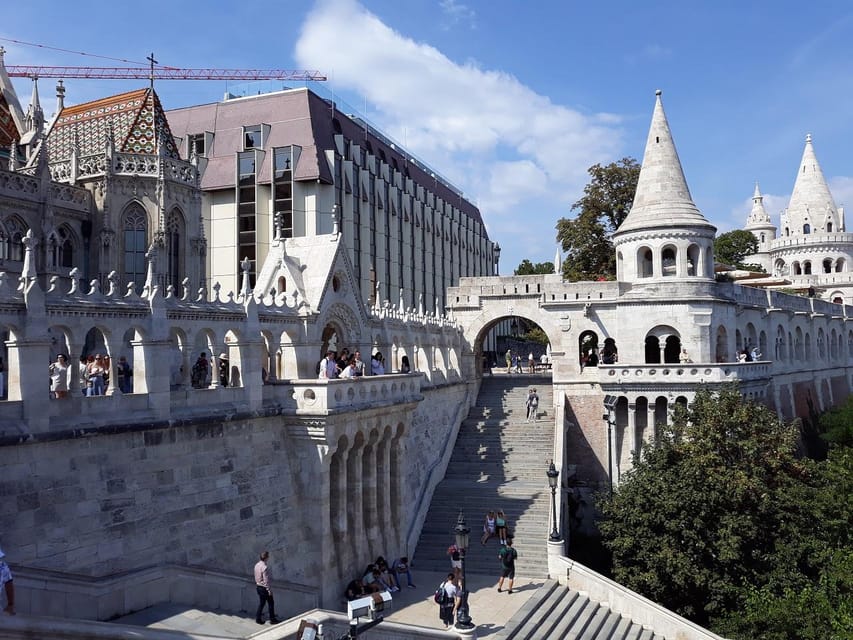 Budapest: Buda Castle Walking Tour & Folk Music Performance - Matthias Church and the religious center of Castle Hill
