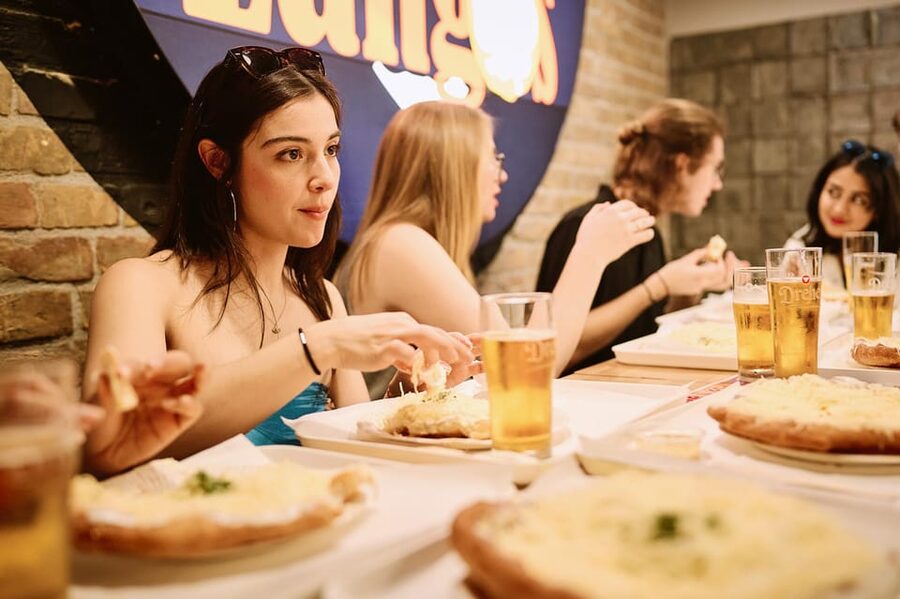Budapest: Guided Food Tour with Wine, Beer, and Shots - Moving from street stalls to sit-down Hungarian dishes